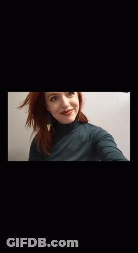 Woman With Red Hair In Turtleneck GIF
