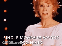 Woman With Red Hair In White Top GIF