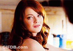 Woman With Red Hair Looking At Camera GIF