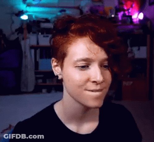 Woman With Red Hair Making Face GIF
