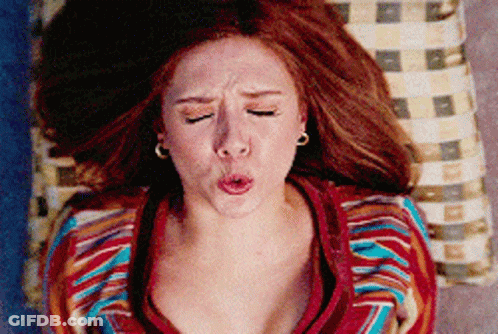 Woman With Red Hair Making Funny Face GIF