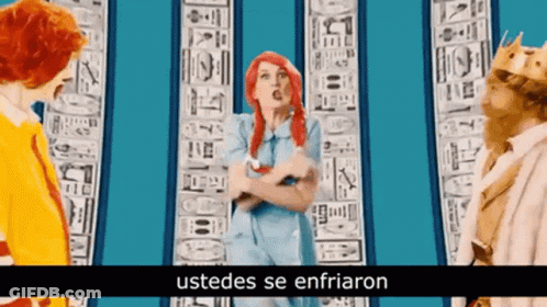 Woman With Red Hair Next To McDonald's Character And Man In Crown GIF