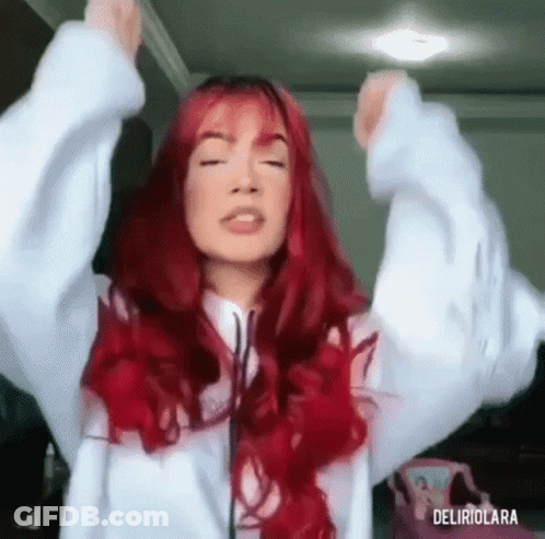 Woman With Red Hair Raising Arms GIF