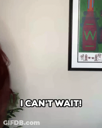 Woman With Red Hair Saying I Can T Wait In Front Of Framed Picture GIF