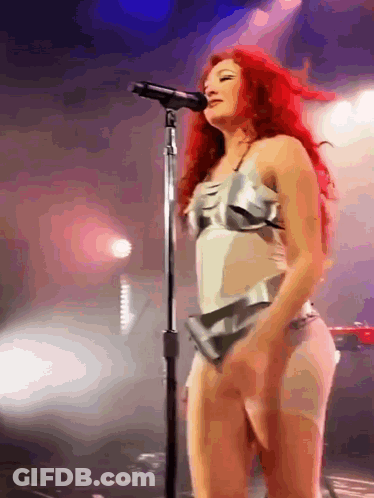 Woman With Red Hair Singing On Stage GIF