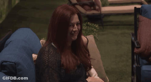 Woman With Red Hair Sitting On Blue Chair GIF