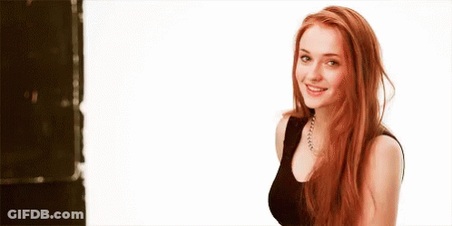 Woman With Red Hair Smiling In Black Top GIF
