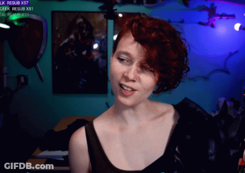 Woman With Red Hair Smiling In Front Of Geek Resub X57 GIF