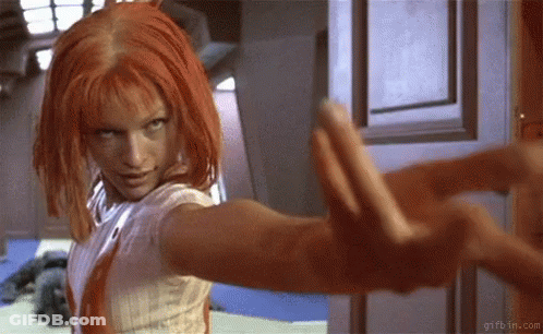 Woman With Red Hair Standing In Front Of Door GIF