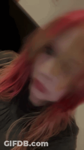 Woman With Red Hair Taking Selfie GIF