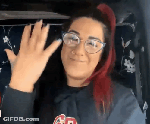 Woman With Red Hair Waving GIF
