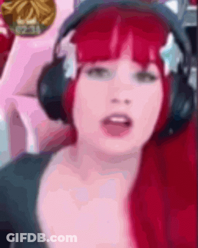 Woman With Red Hair Wearing Headphones GIF