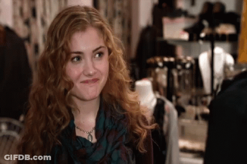 Woman With Red Hair Wearing Scarf And Necklace GIF