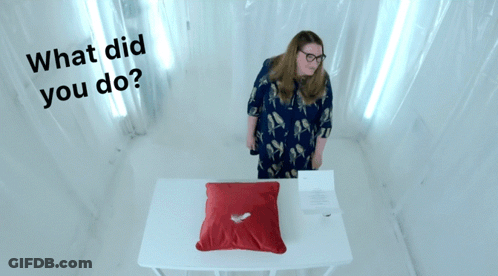 Woman With Red Heart Pillow Saying What Did You Do GIF