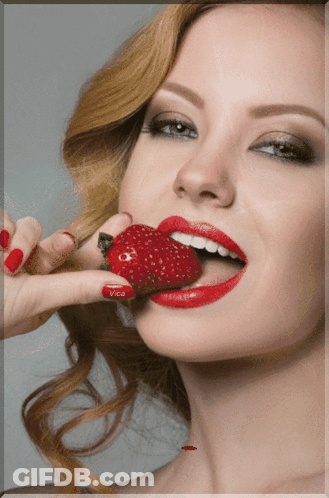 Woman With Red Lips And Nails Eating Strawberry With Vice On Nails GIF