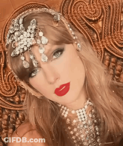 Woman With Red Lipstick And Rhinestone Headpiece GIF