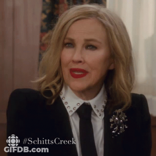 Woman With Red Lipstick And Schitt's Creek Logo GIF