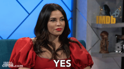 Woman With Red Lipstick And White Flower In Hair GIF