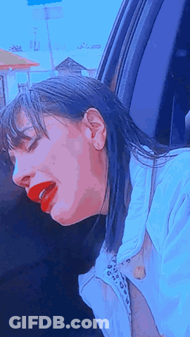 Woman With Red Lipstick Head Out Car Window GIF