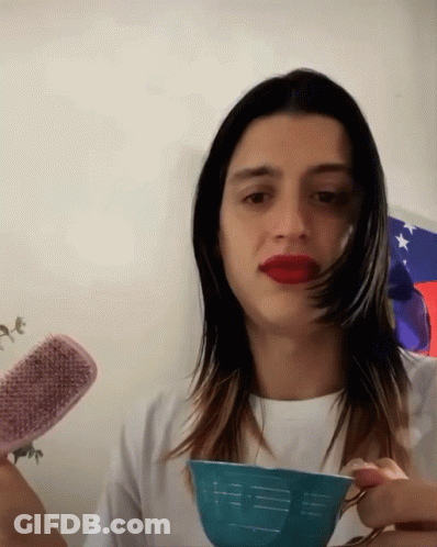 Woman With Red Lipstick Holding Brush And Bowl GIF