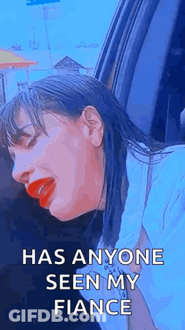 Woman With Red Lipstick Sitting In Car Eyes Closed GIF