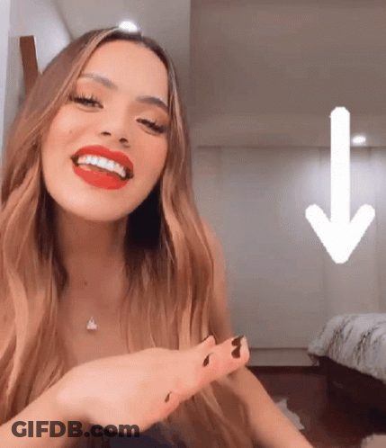 Woman With Red Lipstick Smiling With Down Arrow GIF