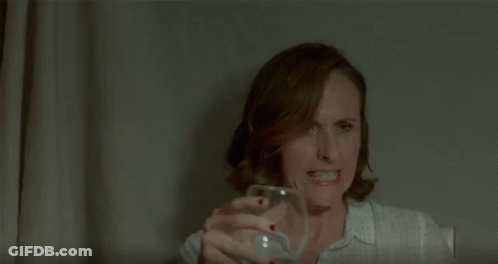Woman With Red Nail Polish Covering Nose GIF