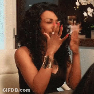 Woman With Red Nails And Ring Covering Mouth GIF