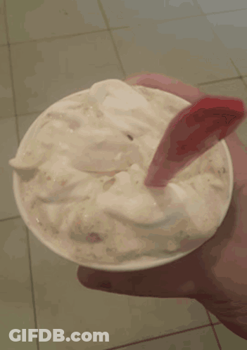 Woman With Red Nails Holding Ice Cream GIF