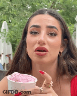 Woman With Red Nails Holding Ice Cream GIF