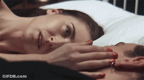 Woman With Red Nails Laying On Man's Chest GIF