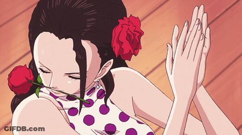 Woman With Red Rose In Hair Holding Hands GIF