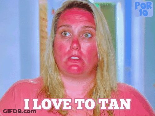 Woman With Red Spots Saying I Love To Tan GIF