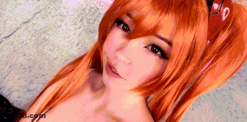 Woman With Red Wig And Heart On Hair GIF