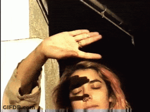 Woman With Ring Holding Hand Over Head GIF