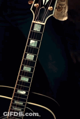 Woman With Ring Playing Electric Guitar GIF