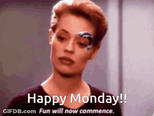 Woman With Robotic Eye Saying Happy Monday GIF