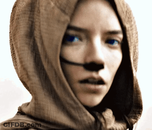 Woman With Scarf Around Head And Blue Eyes GIF