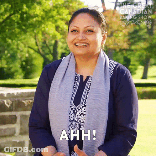 Woman With Scarf Smiling Saying Ahh GIF
