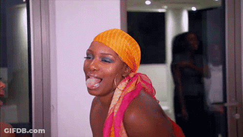 Woman With Scarf Sticking Out Tongue GIF