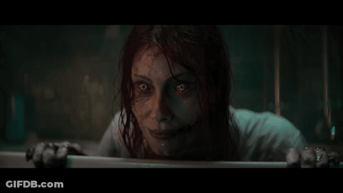 Woman With Scary Face Looking Out Window GIF