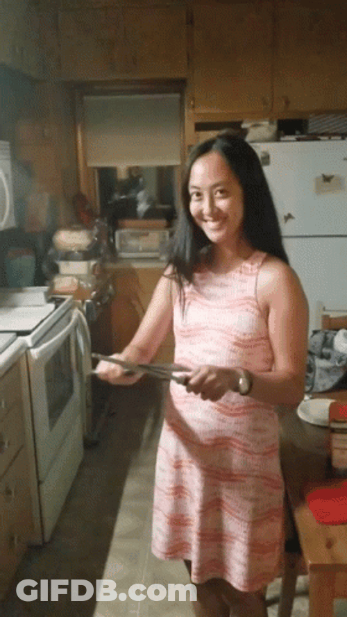 Woman With Scary Smile While Sharpening Knife GIF