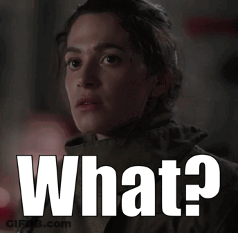 Woman With Serious Look Next To What GIF