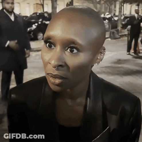 Woman With Shaved Head And Nose Ring GIF