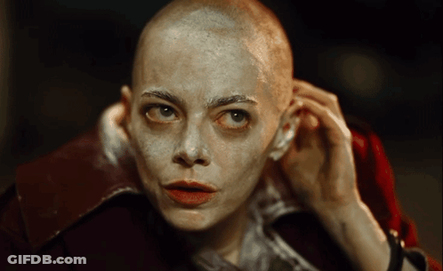 Woman With Shaved Head And Red Jacket GIF