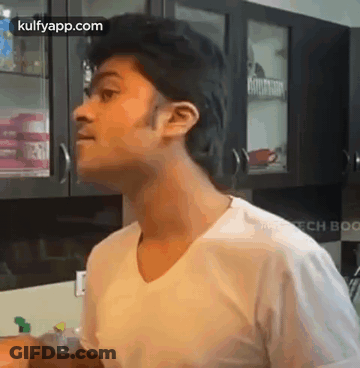 Woman With Shaved Head Crying In Bathroom GIF
