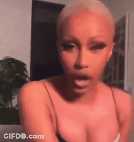 Woman With Shaved Head Making Funny Face GIF