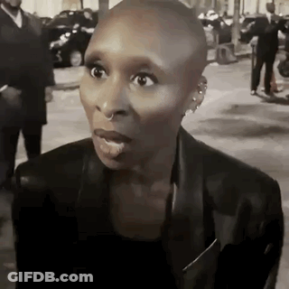 Woman With Shaved Head Making Funny Face GIF