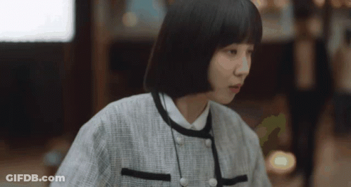 Woman With Short Black Hair In White Shirt GIF