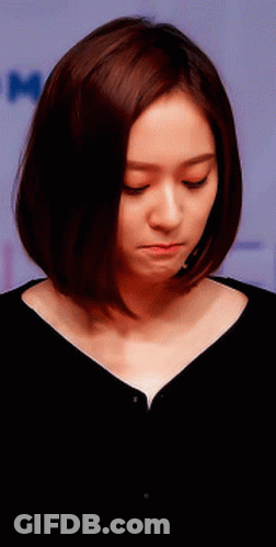 Woman With Short Brown Hair Looking Down GIF